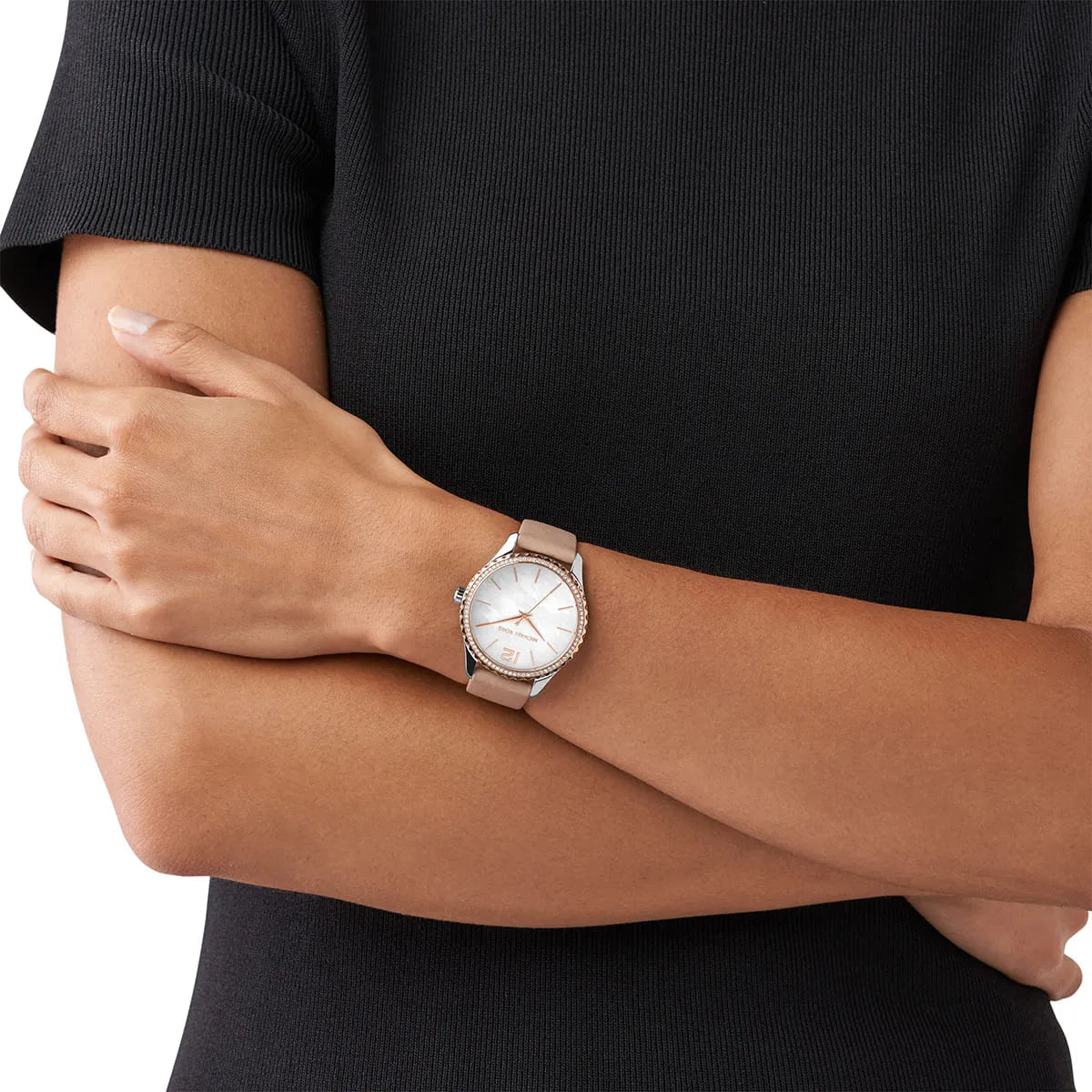 Michael Kors Layton watch worn on wrist showing white dial and beige leather strap