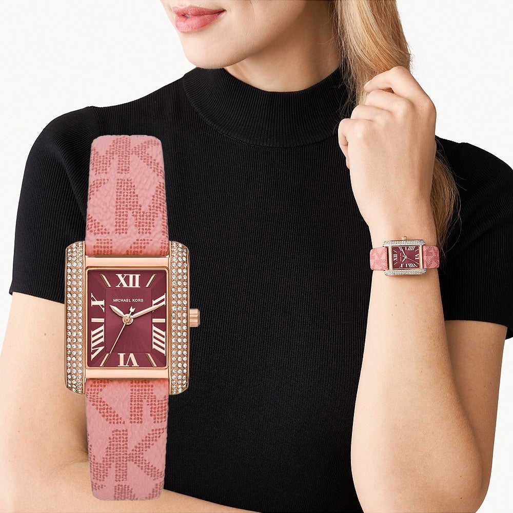Michael Kors Emery MK2966 watch worn on wrist with burgundy dial and primrose pink strap