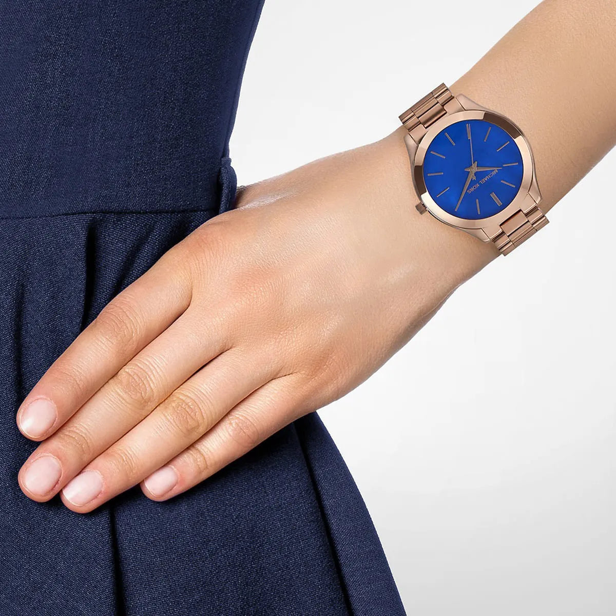 Michael Kors Slim Runway MK3494 worn on wrist showing blue dial and rose gold strap