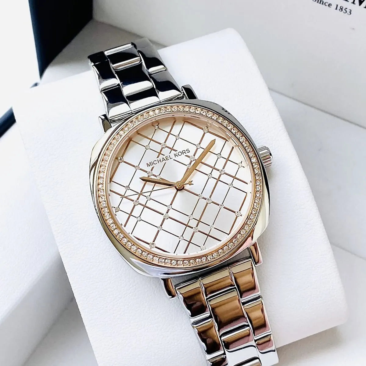 Michael Kors Nia watch in luxury packaging showing silver and rose gold two-tone design