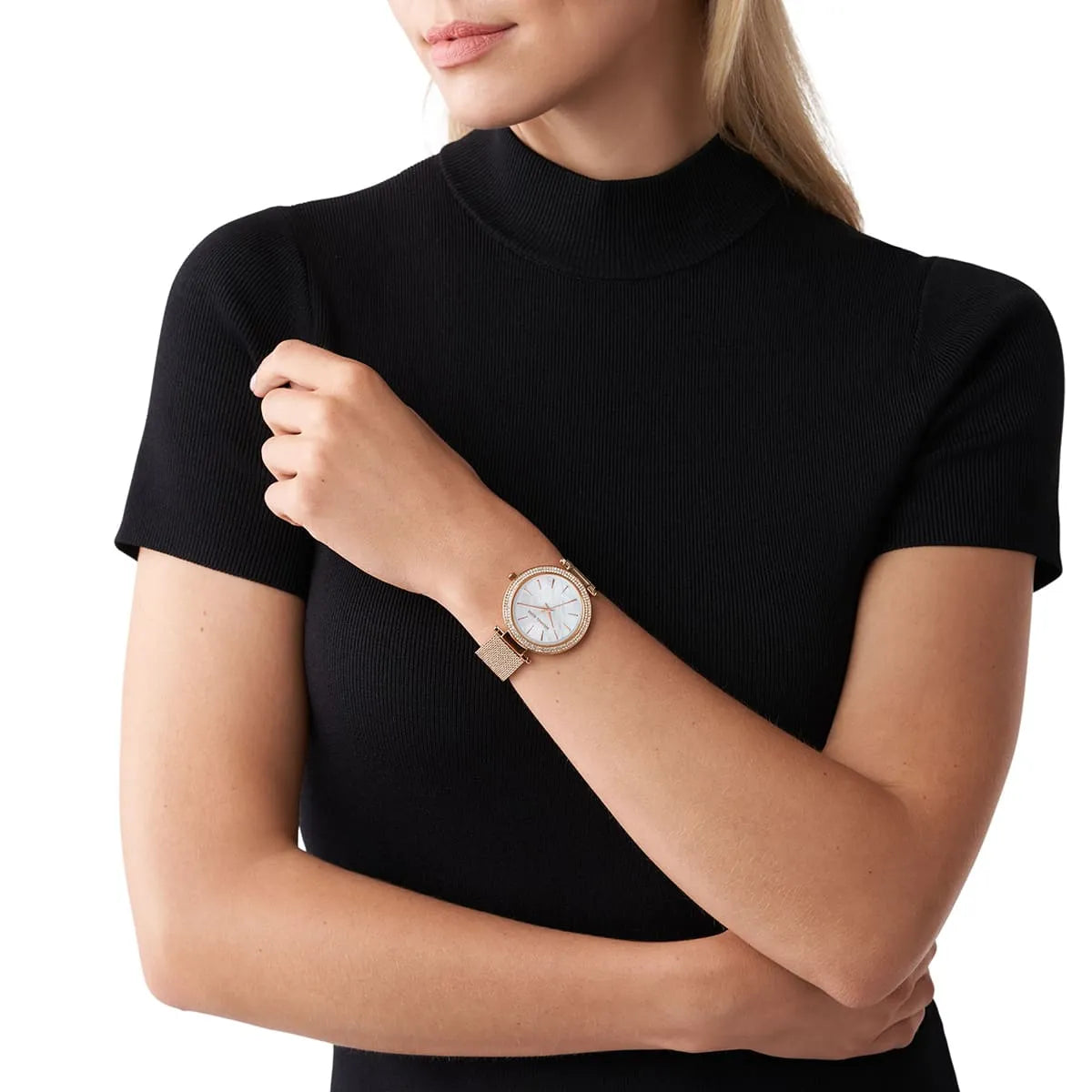 Michael Kors Darci watch worn on wrist, white dial visible with rose-gold mesh band