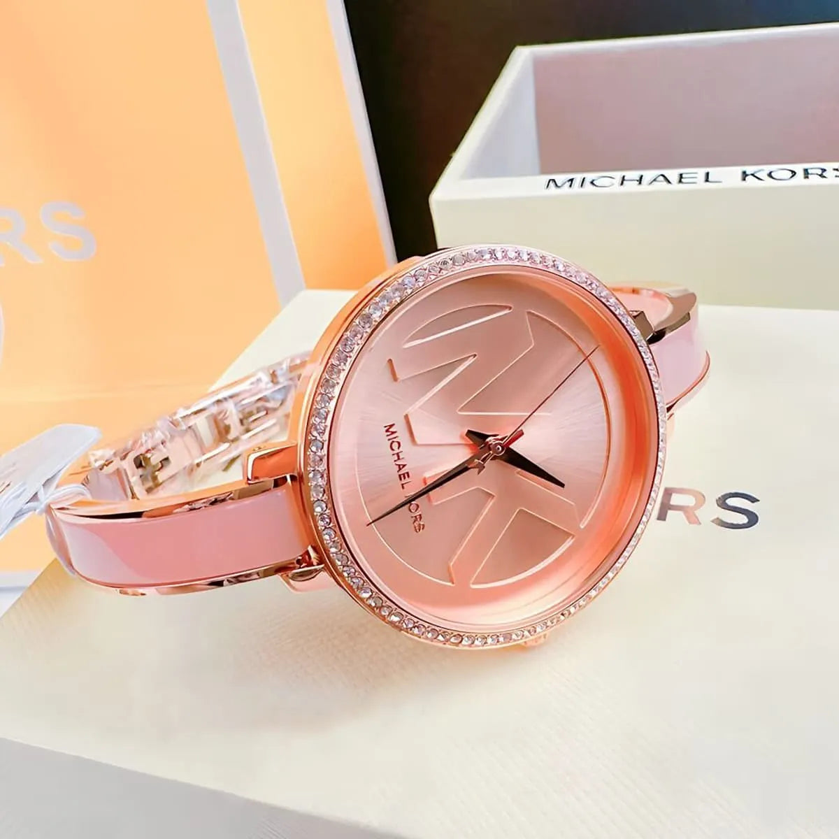Michael Kors Jaryn watch with packaging and display box background