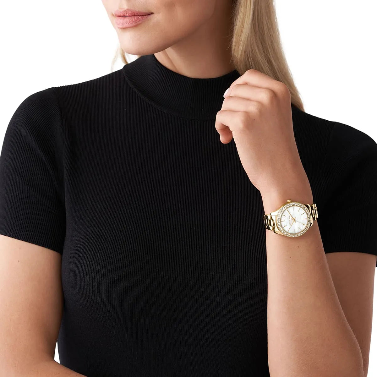 Michael Kors Liliane MK4555 women's watch worn on wrist with gold bracelet