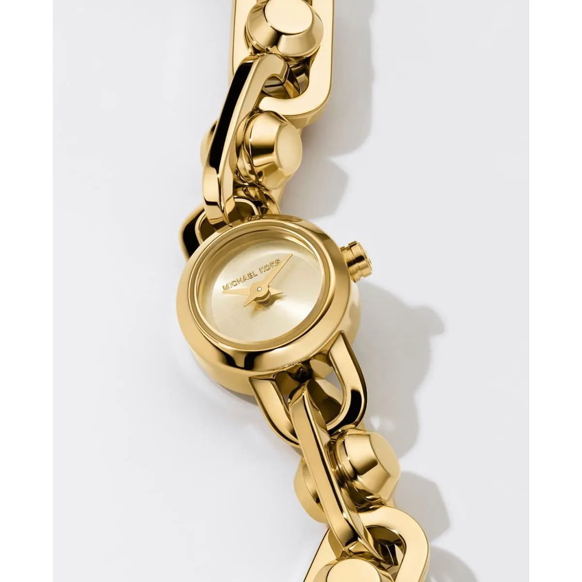 MK Astor Link watch dial and case detail on decorative link bracelet