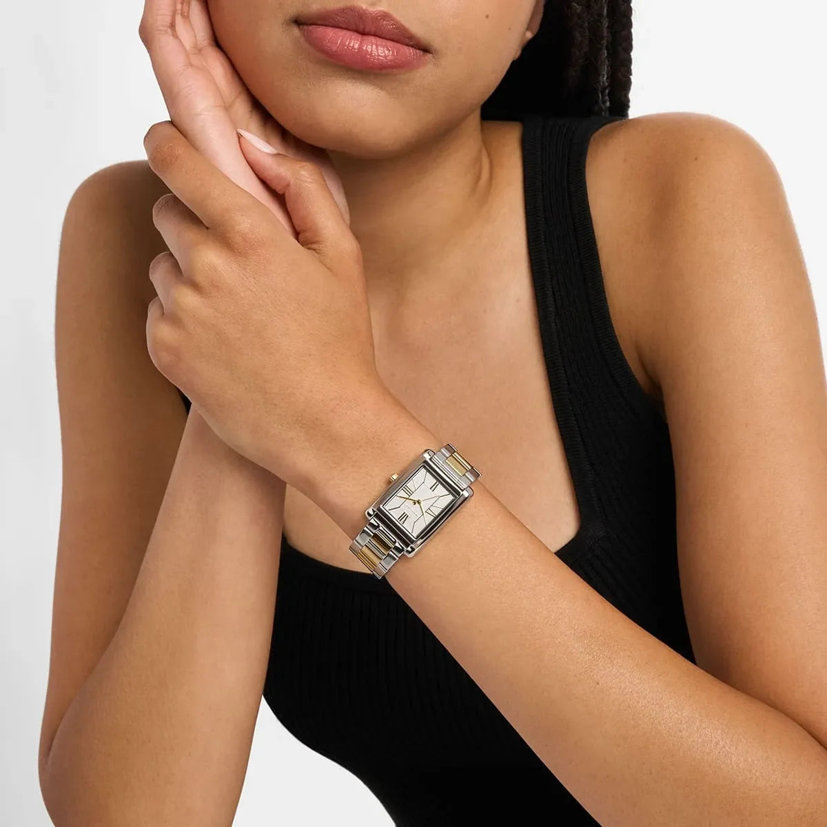 Michael Kors Essex women's watch worn on wrist showing white dial and two-tone bracelet
