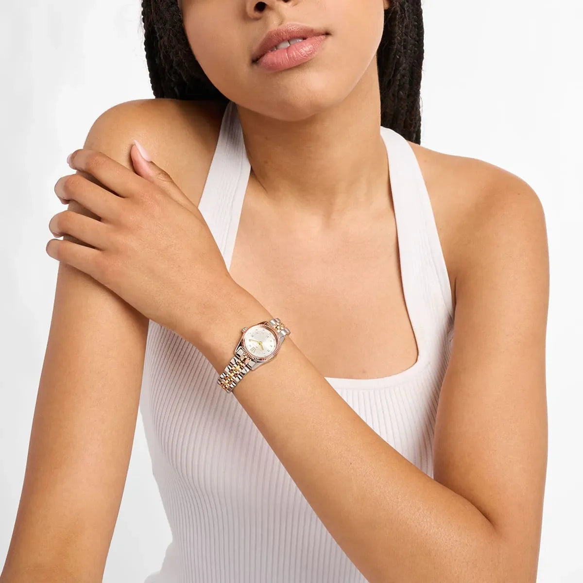 Michael Kors Lexington MK4987 worn on wrist showing two-tone bracelet and silver dial with crystal markers