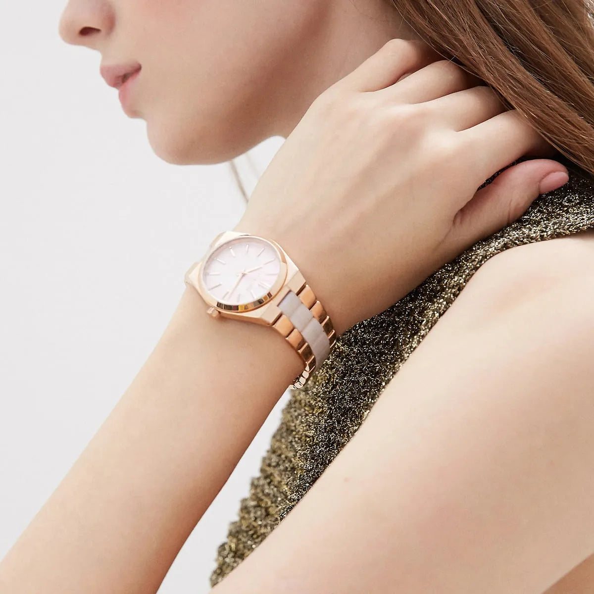 Michael Kors Channing watch worn on wrist, showing rose gold case and dial detail