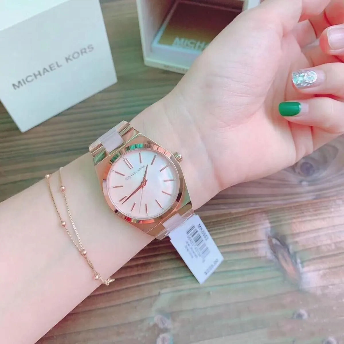 Michael Kors Channing watch worn on wrist with Michael Kors packaging