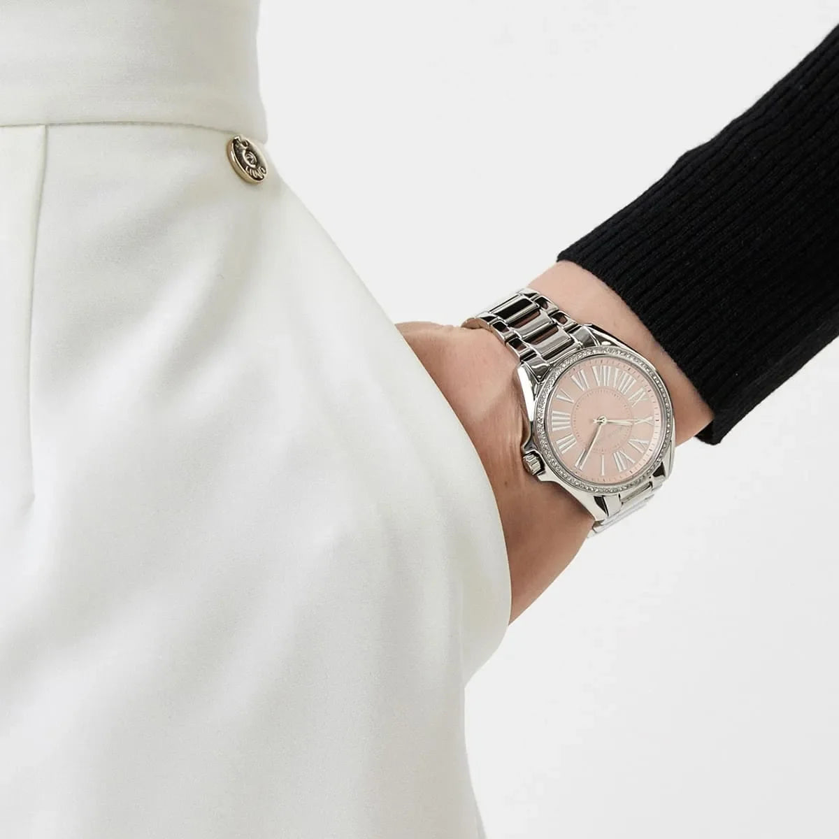 Michael Kors Kacie watch styled on wrist with casual clothing showing pink face