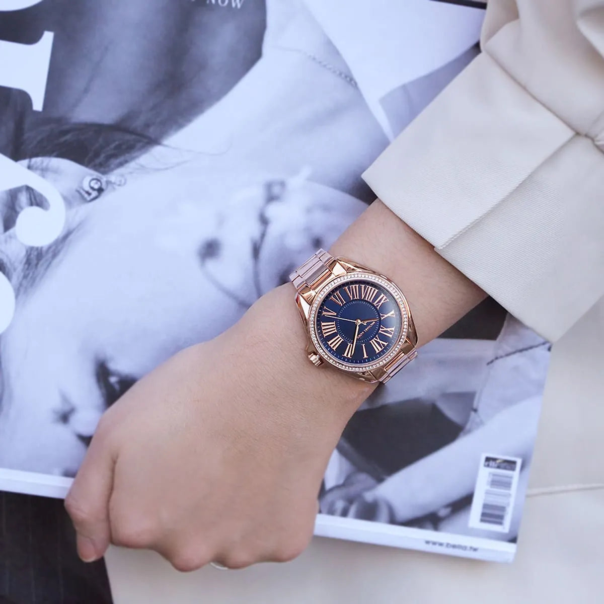 Kacie MK6930 watch worn on wrist showing navy blue dial with rose gold case and crystal accents
