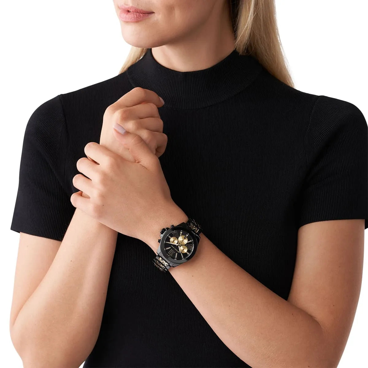 Michael Kors Wren chronograph watch worn on wrist, black dial with gold chronograph subdials