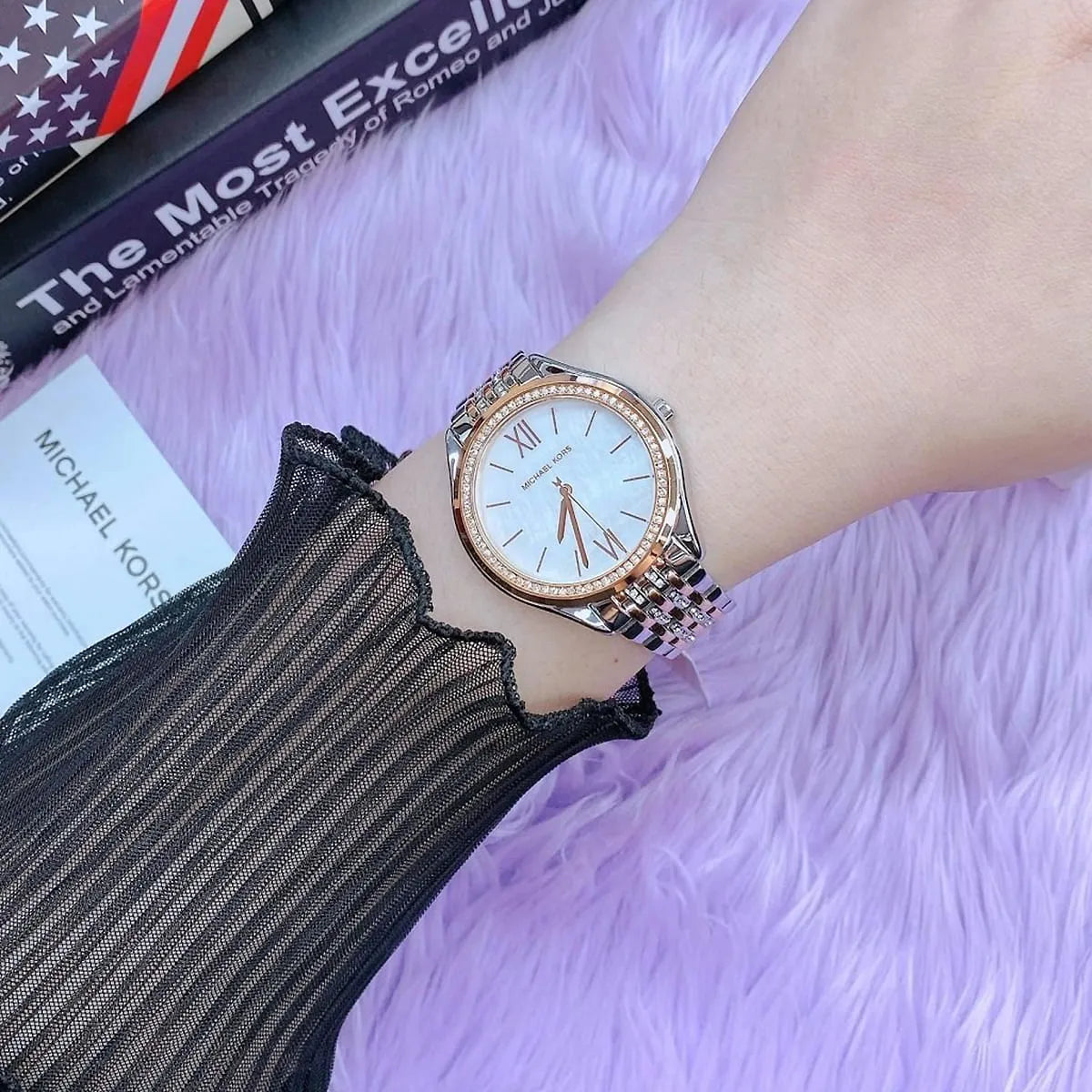 Mindy watch on-wrist lifestyle shot showing rose gold and silver two-tone bracelet and white dial