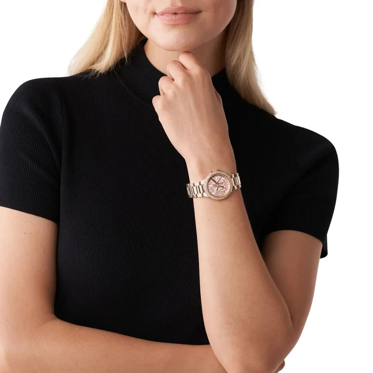 Michael Kors Camille watch worn on wrist showing rose gold case, pink dial, and crystal bezel detail
