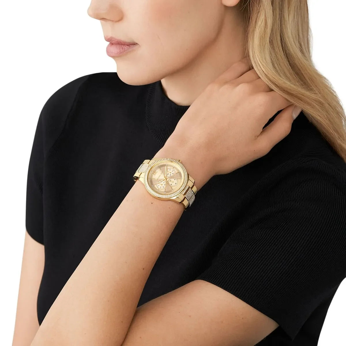 Michael Kors Tibby MK7292 gold watch worn on wrist in black outfit