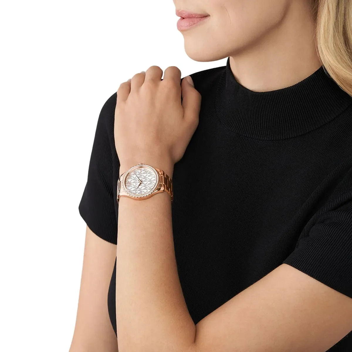 Michael Kors Layton MK7297 rose gold watch worn on wrist, white dial with pavé detailing