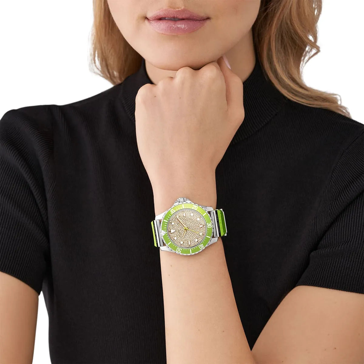 Michael Kors Everest women's watch worn on wrist featuring green silicone strap and crystal dial