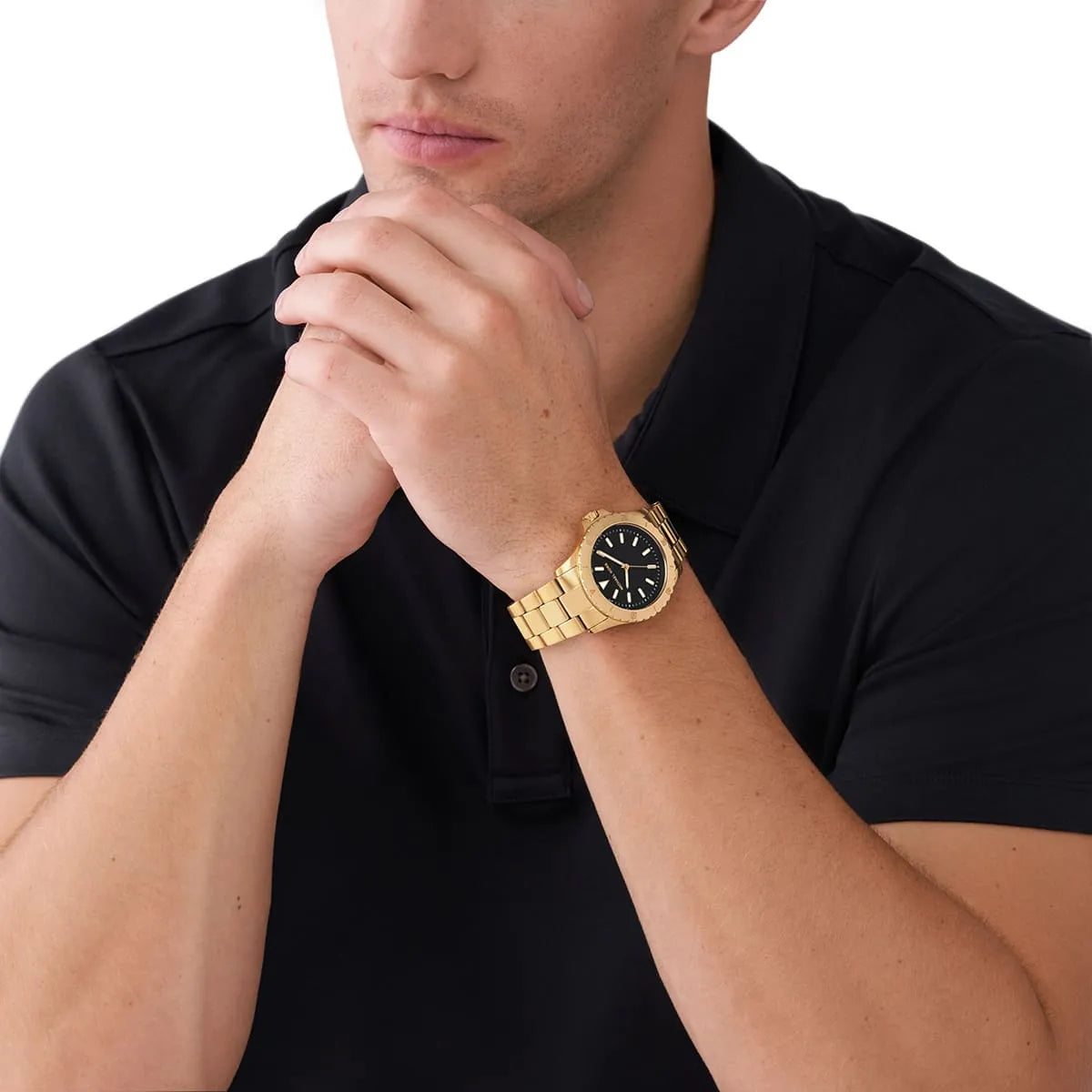 Michael Kors Everest men's watch worn on wrist with black dial and gold-tone case