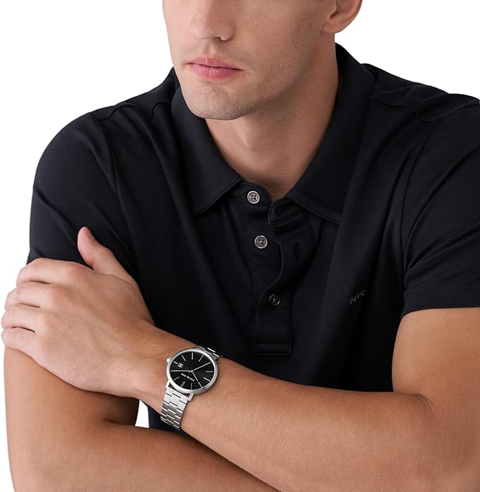 Michael Kors MK9133 men's watch worn on wrist with black dial and silver bracelet