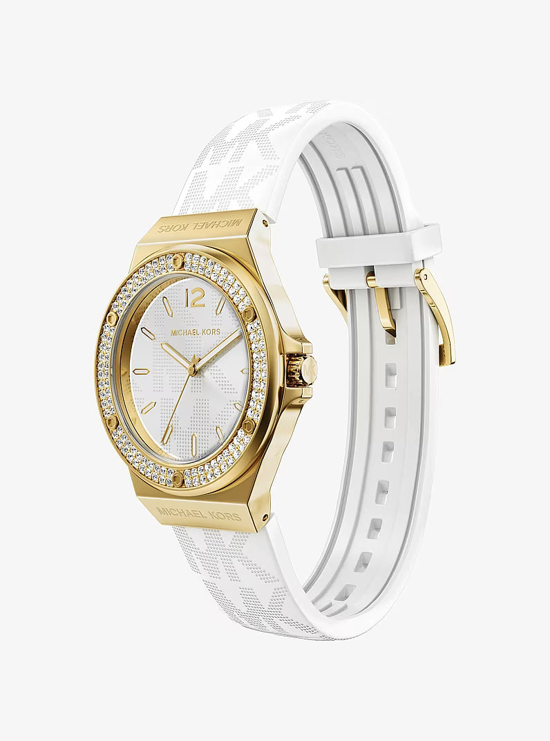 Angled view of Michael Kors Lennox gold-tone watch with white logo silicone strap