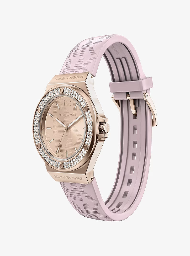 Angled view of Michael Kors Lennox women's watch with interchangeable pink and gray silicone straps