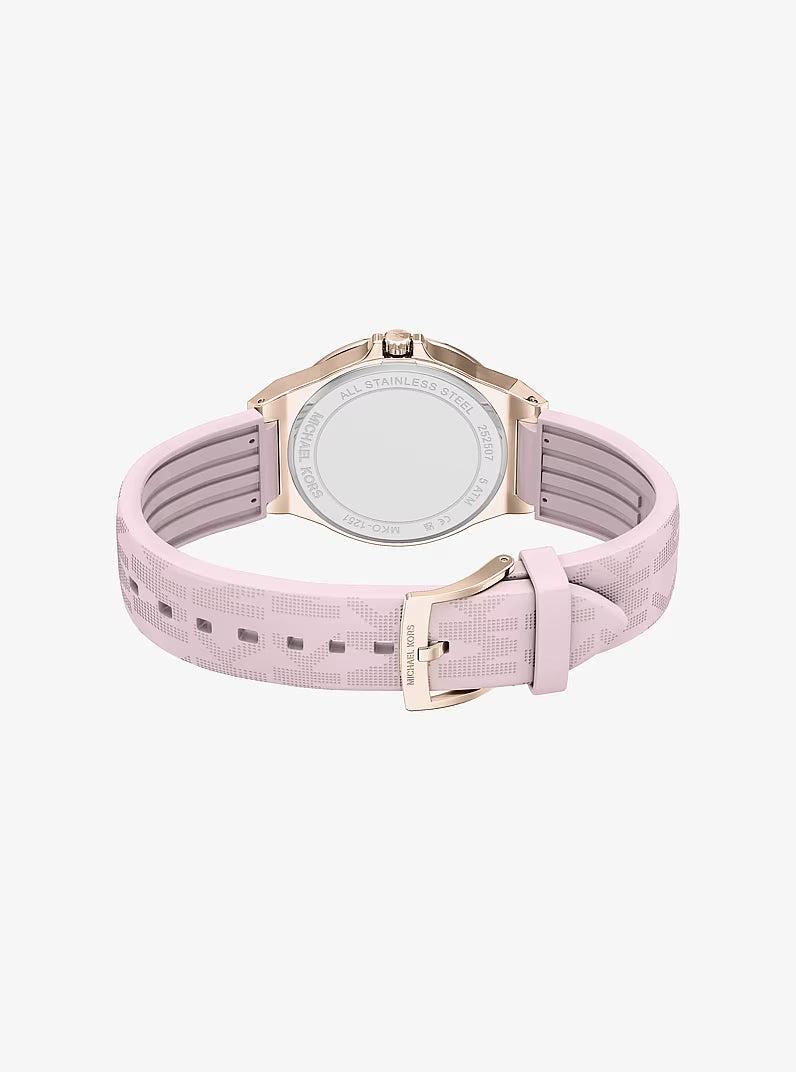 Michael Kors Lennox watch strap detail showing pink silicone band with rose gold buckle