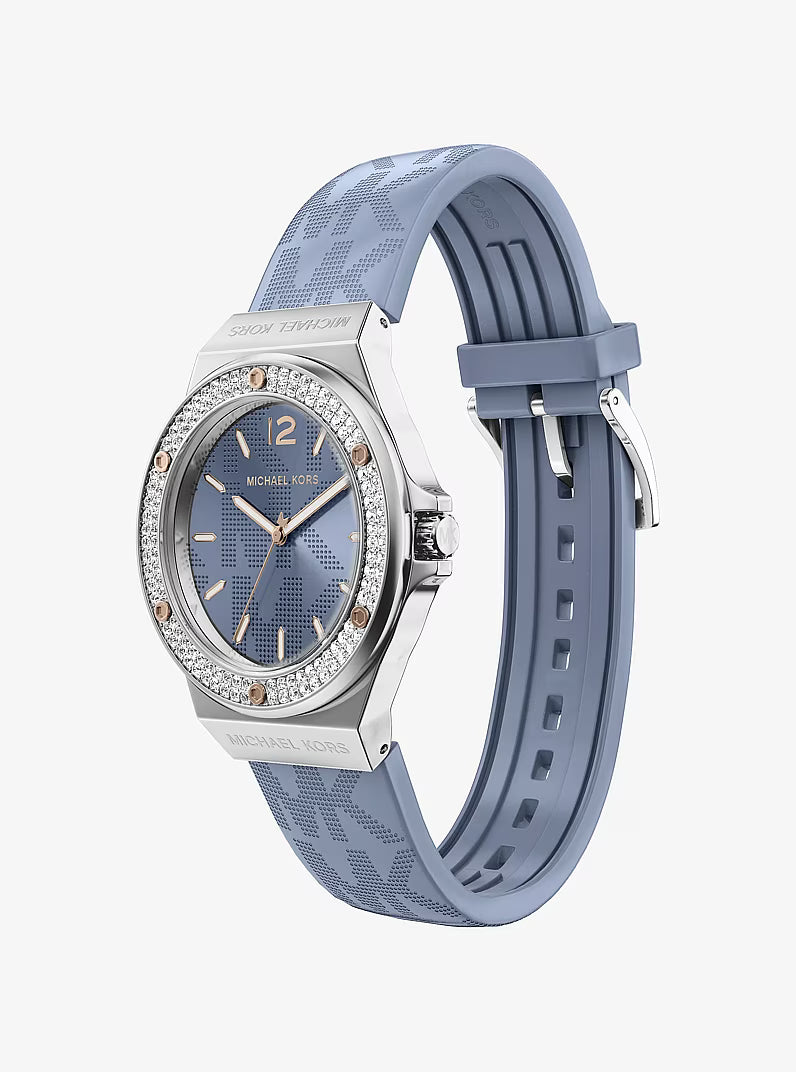 Michael Kors Lennox watch worn on wrist showing silver case and blue strap