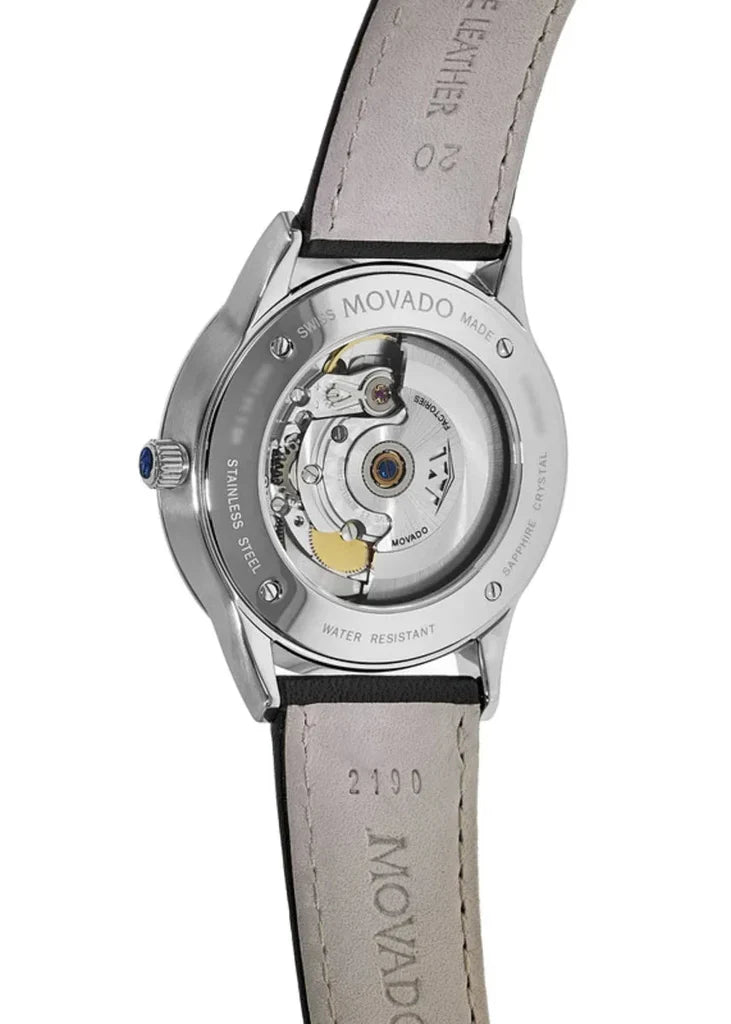 Movado 1881 automatic movement visible through transparent case back with gray leather strap