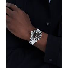 Movado stainless steel watch worn on wrist, on-wrist lifestyle view