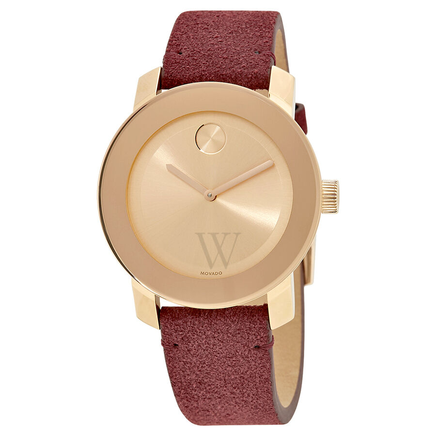 Angled view of Movado Bold women's watch showing rose gold case, red suede strap, and dial detail