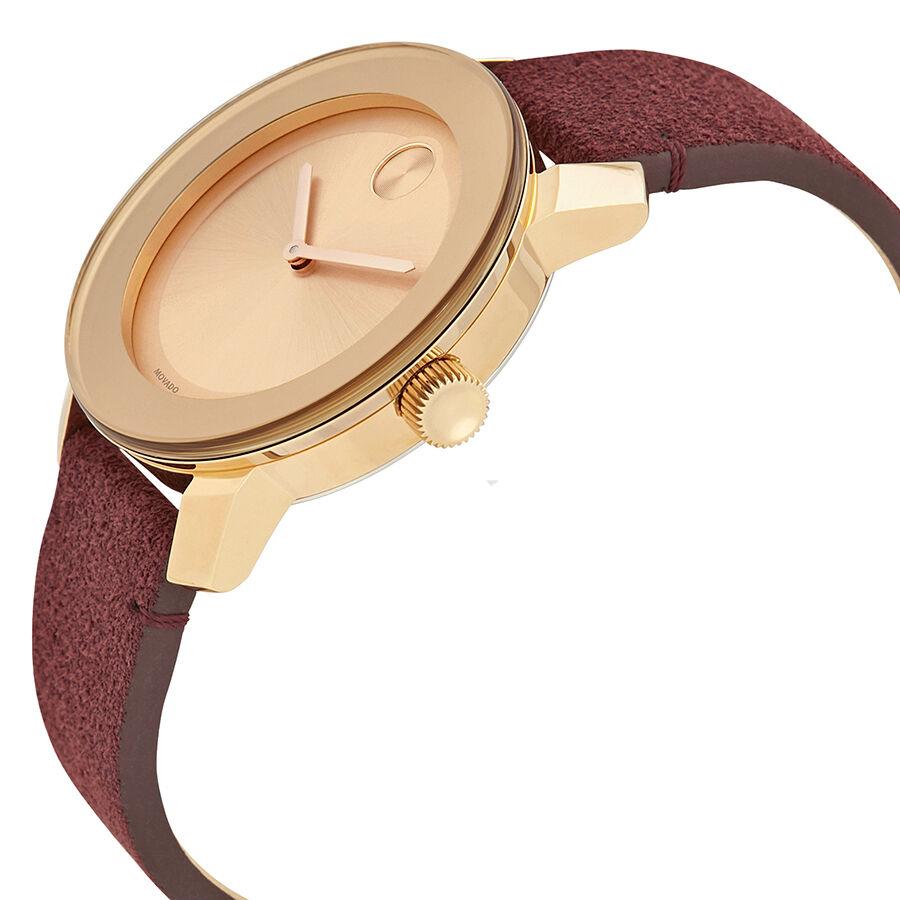 Side profile of Movado Bold women's watch with rose gold case and burgundy suede band