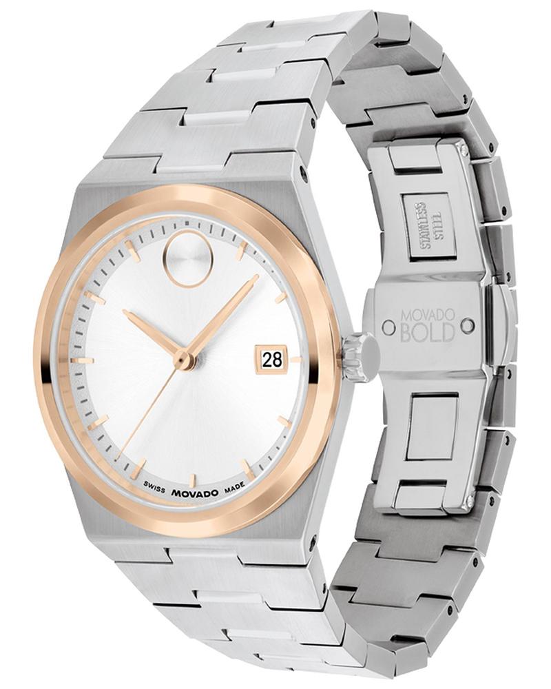 Movado BOLD Quest white dial watch with rose gold bezel and stainless steel bracelet worn on wrist