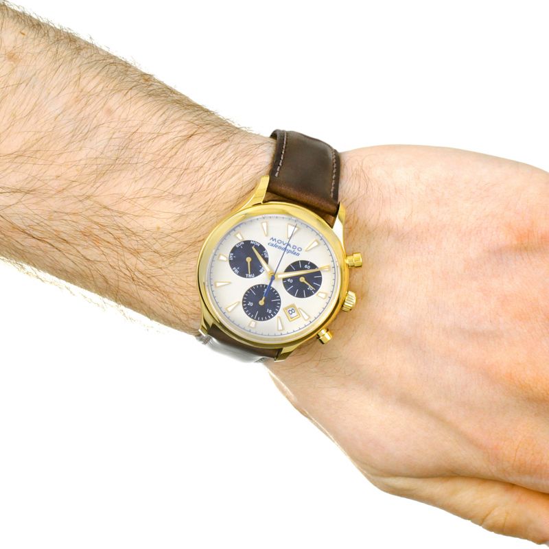 Movado Heritage Chronograph worn on wrist showing parchment dial and gold-tone case