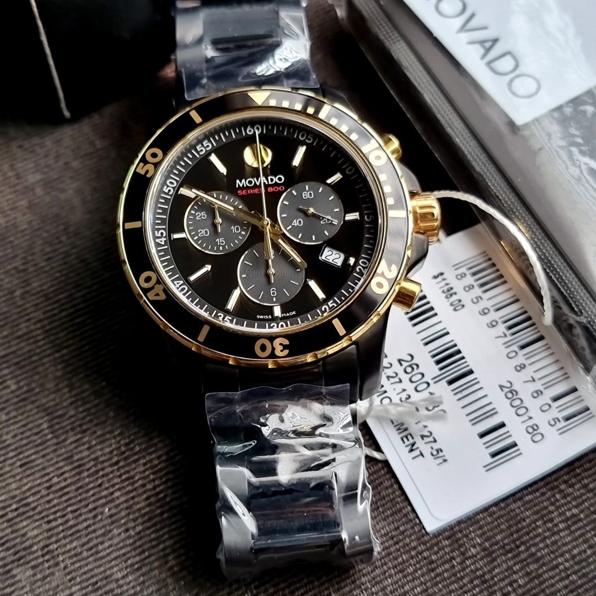 Movado Series 800 black PVD chronograph watch displayed with box and documentation