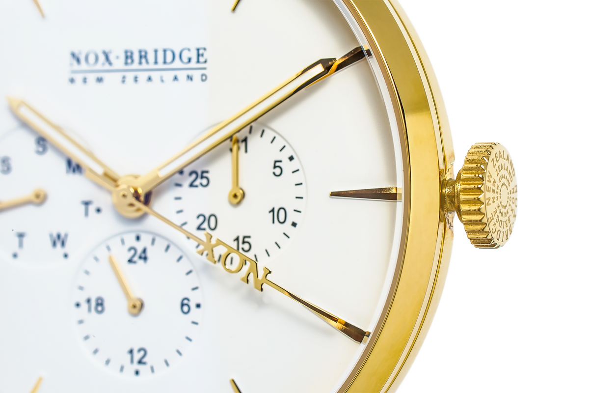 Close-up of Meissa gold watch dial showing chronograph sub-dials and gold plated bezel