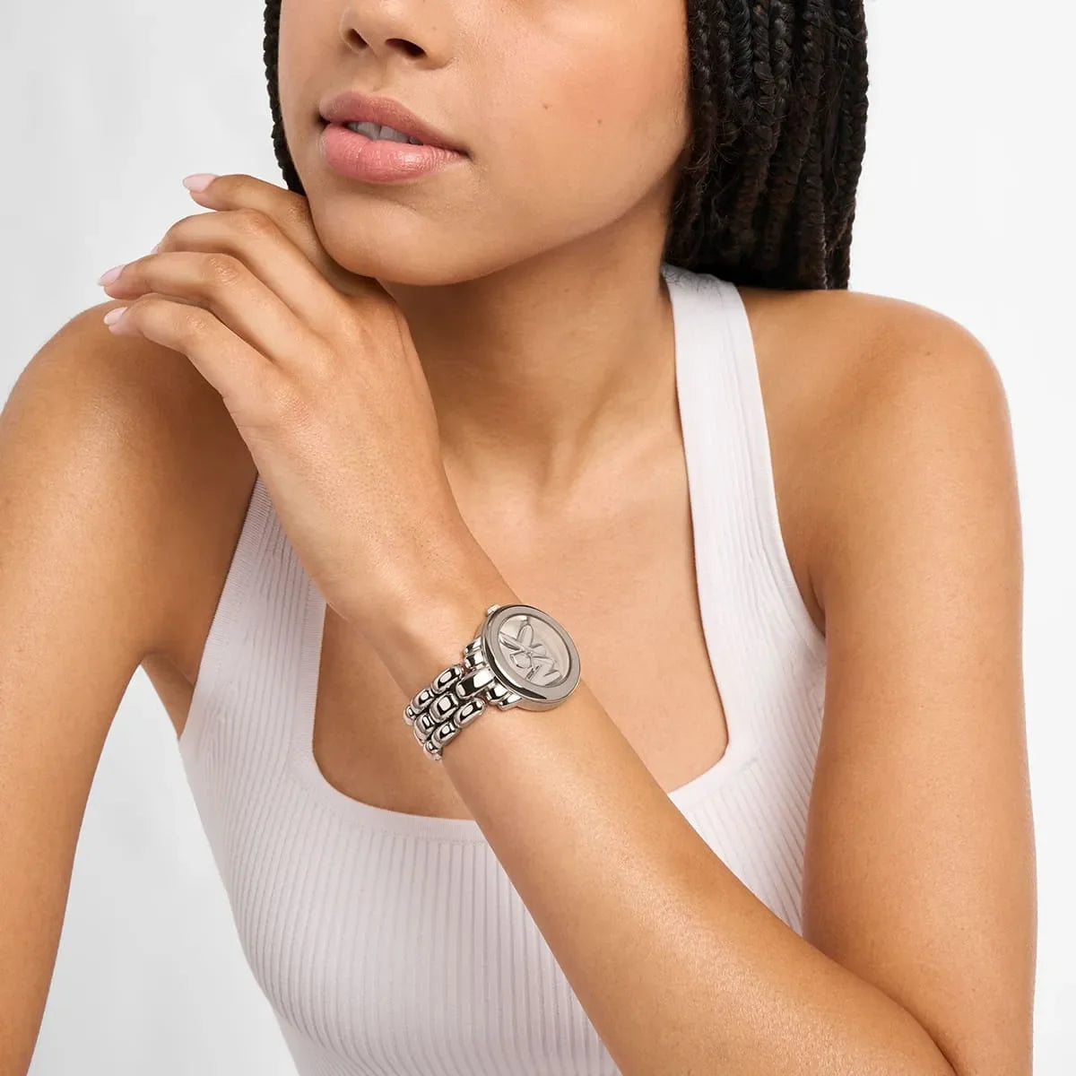 Phoebe silver-tone watch worn on wrist showing MK logo face