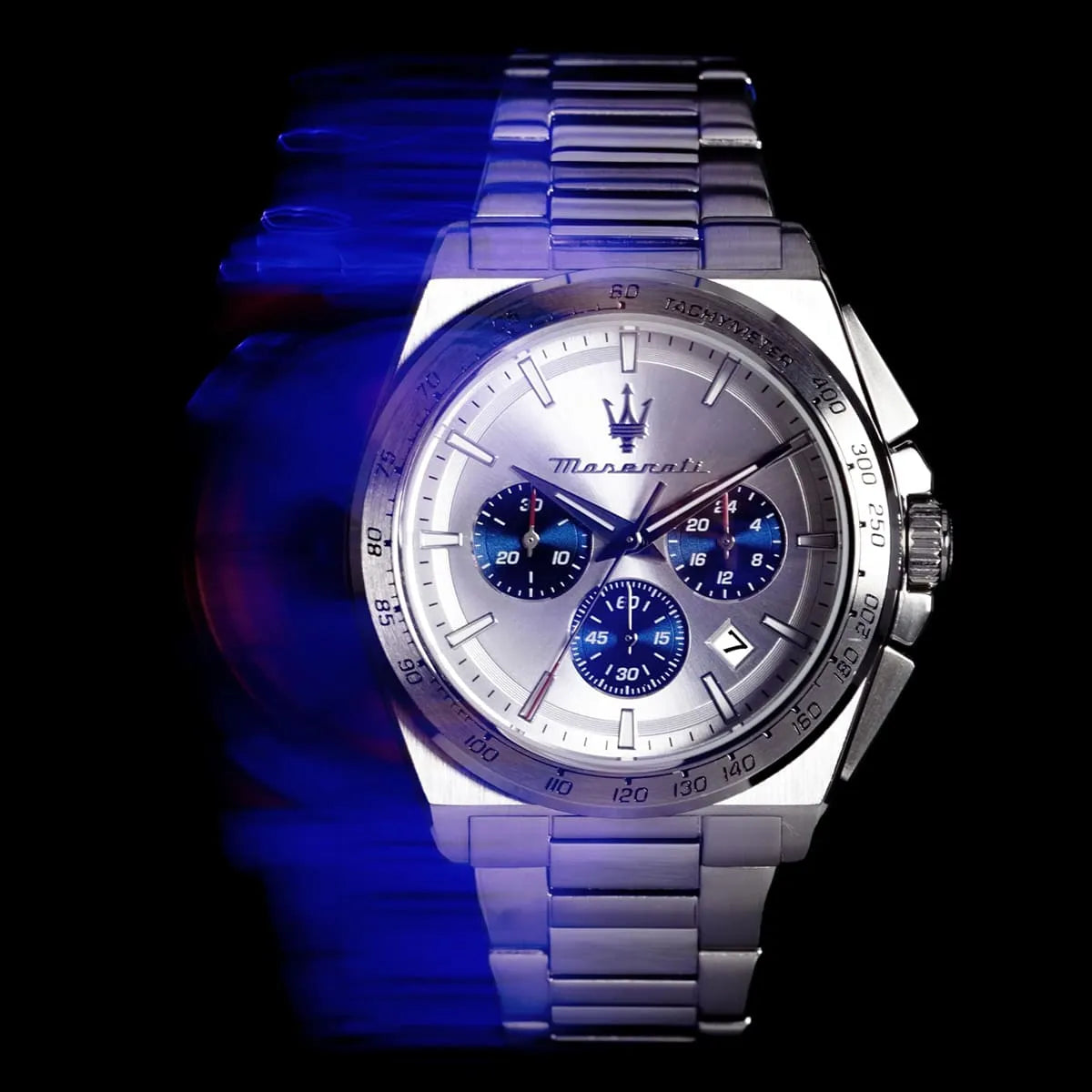 Maserati Velocità chronograph watch artistic lighting shot with blue gradient background