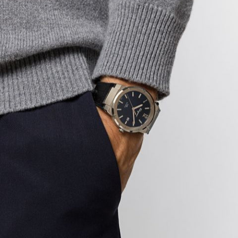 F-80 Classic watch worn on wrist with gray sweater in casual lifestyle shot
