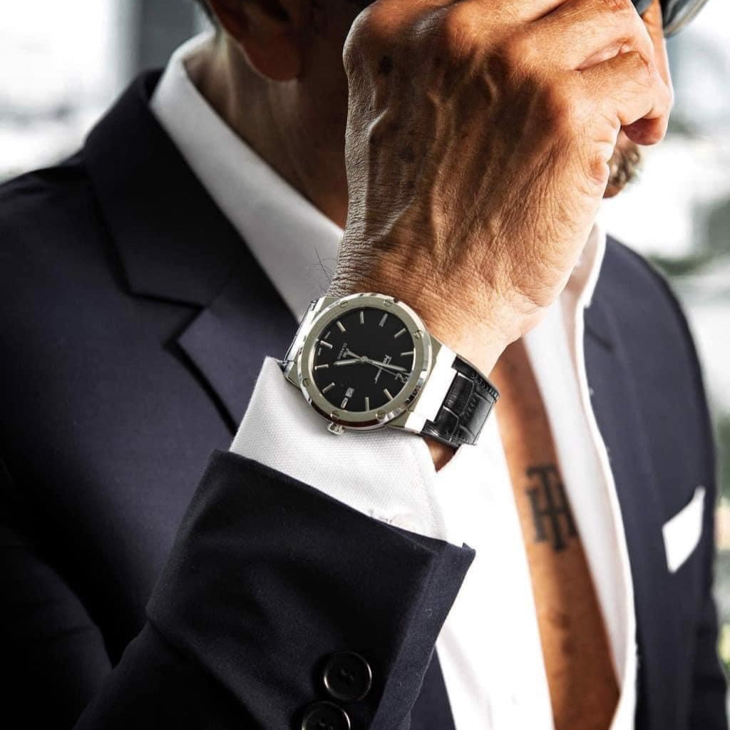 F-80 Classic black watch on wrist with navy blazer and white dress shirt