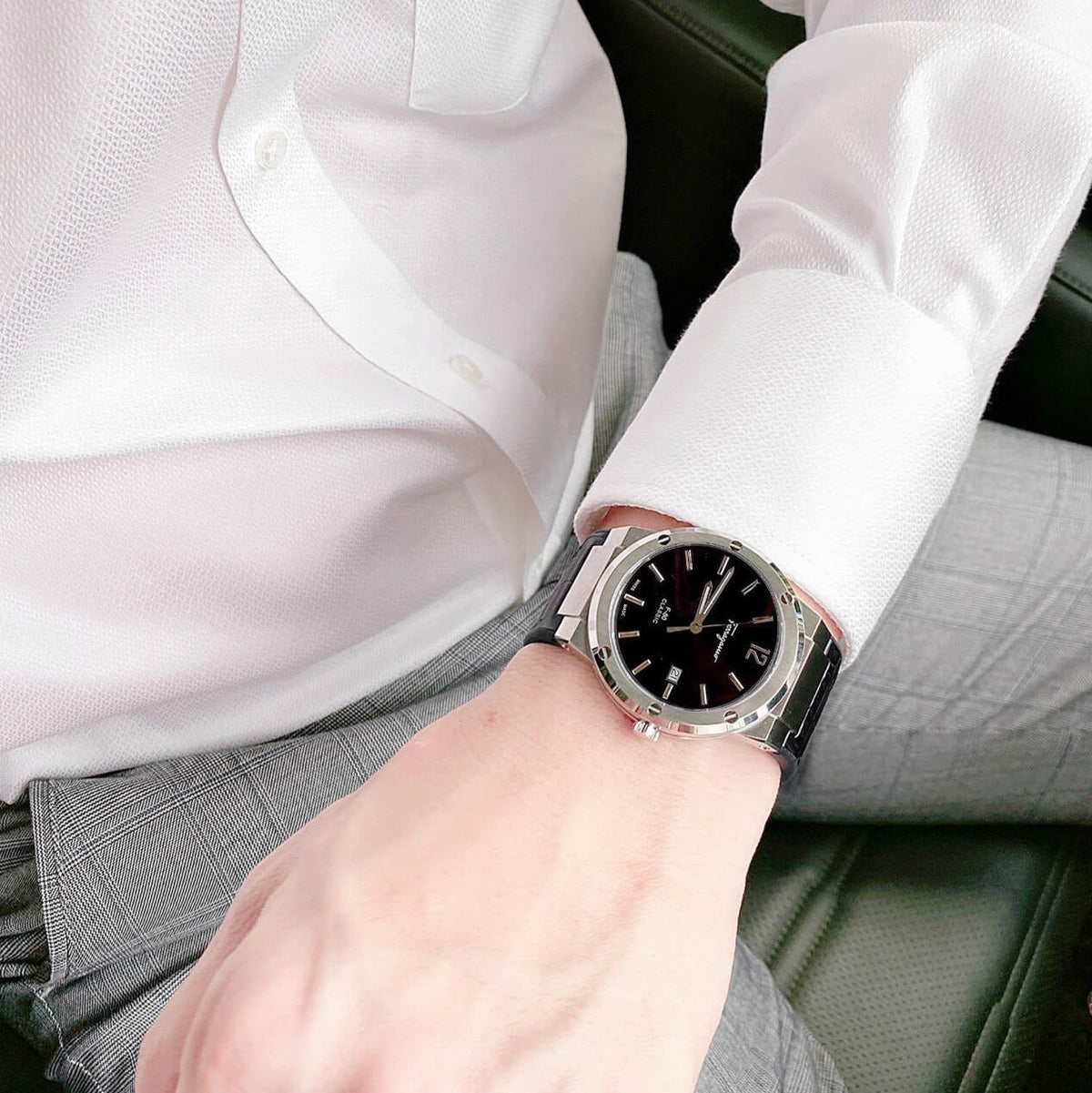 F-80 Classic black watch worn on wrist with white dress shirt sleeve