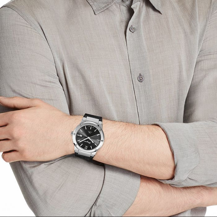 F-80 Classic watch worn on wrist with gray dress shirt in formal setting