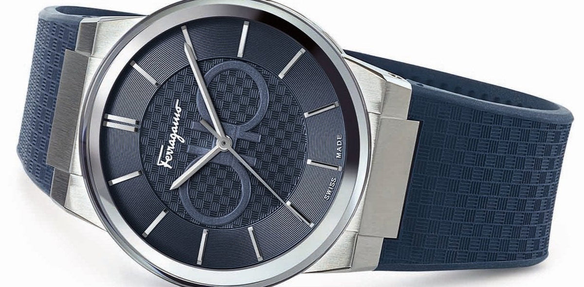 Side view of Ferragamo watch displaying sapphire dial and integrated blue strap