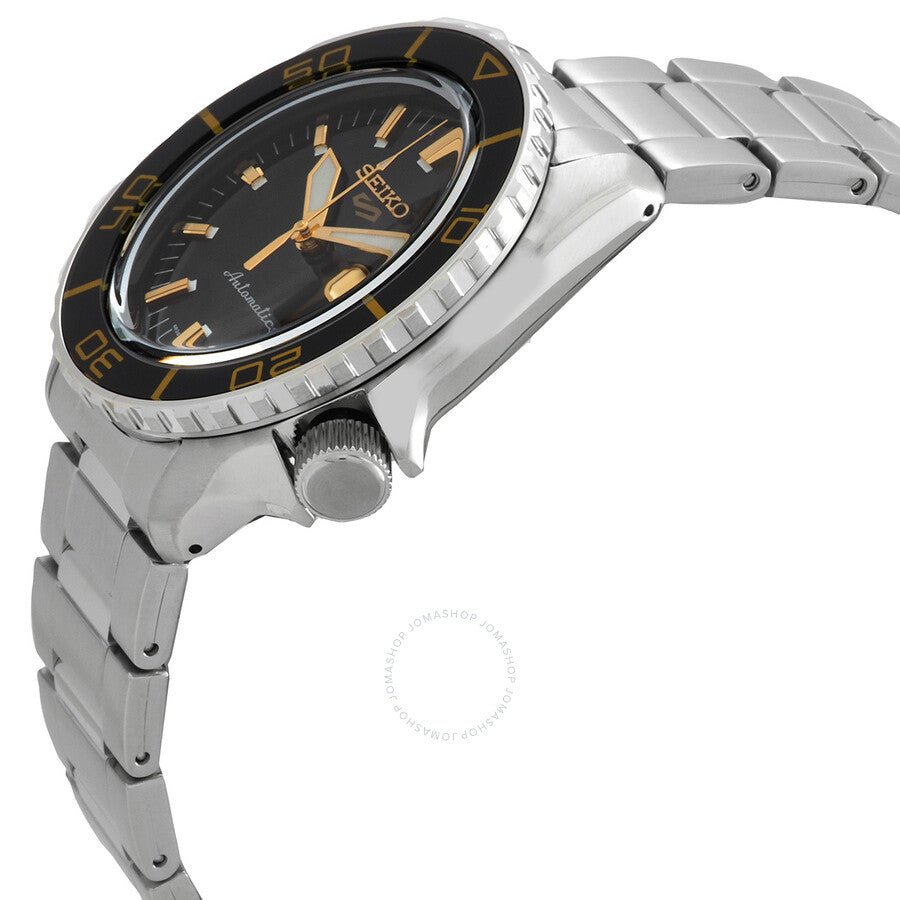 Side angle view of Seiko 5 Sports SKX stainless steel bracelet and black bezel with golden accents