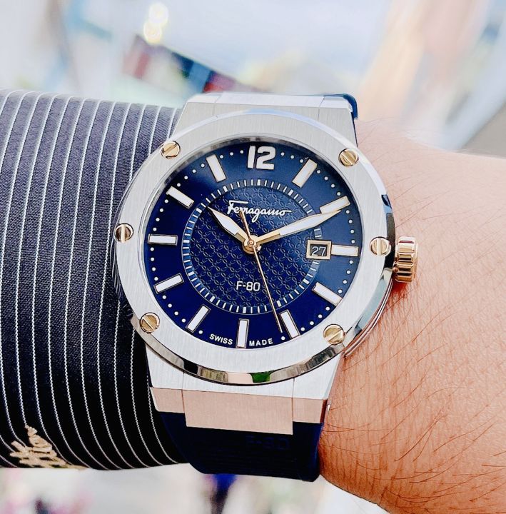 Ferragamo F-80 watch on wrist showing case profile and blue rubber strap