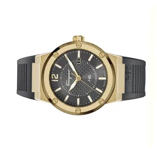 Ferragamo F-80 watch on wrist showing black dial and gold-tone case