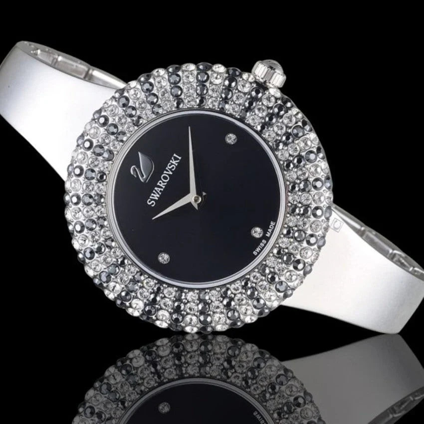 Swarovski crystal watch at angle showing black dial and diamond-studded bezel