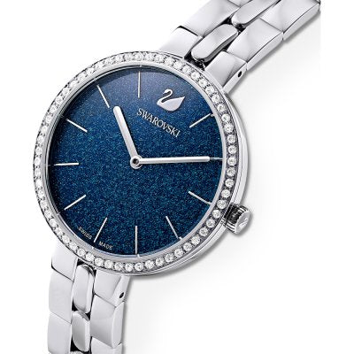 Three-quarter view of Swarovski watch with micro-pave blue dial and crystal bezel