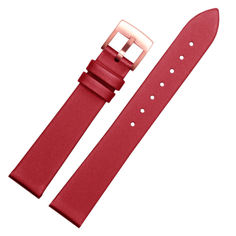 Red leather watch strap with rose gold-tone buckle and adjustment holes