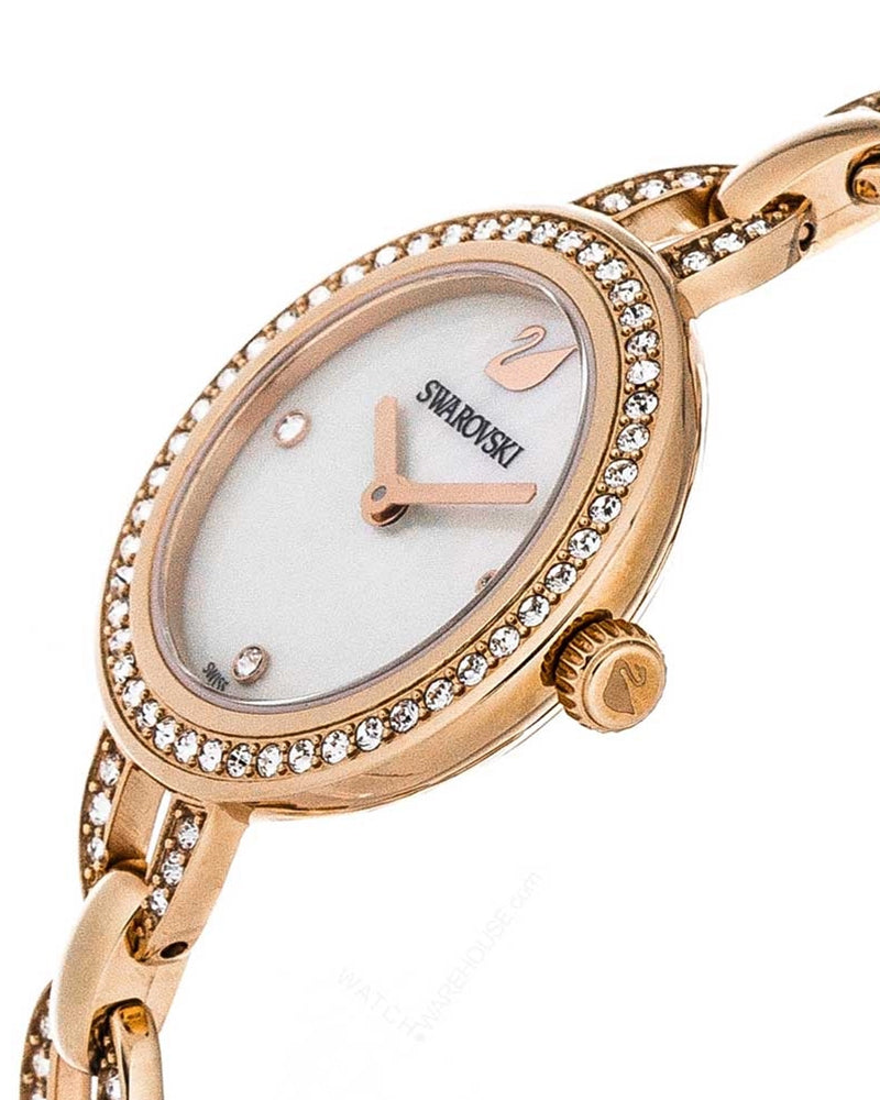 Close-up of Swarovski Aila dial showing white mother-of-pearl face, crystal markers, and rose gold hands