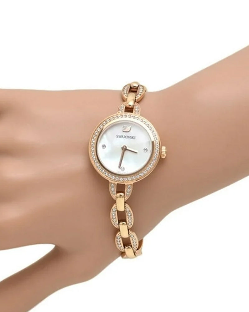 Swarovski Aila quartz watch worn on wrist, displaying rose gold case and crystal-adorned bracelet