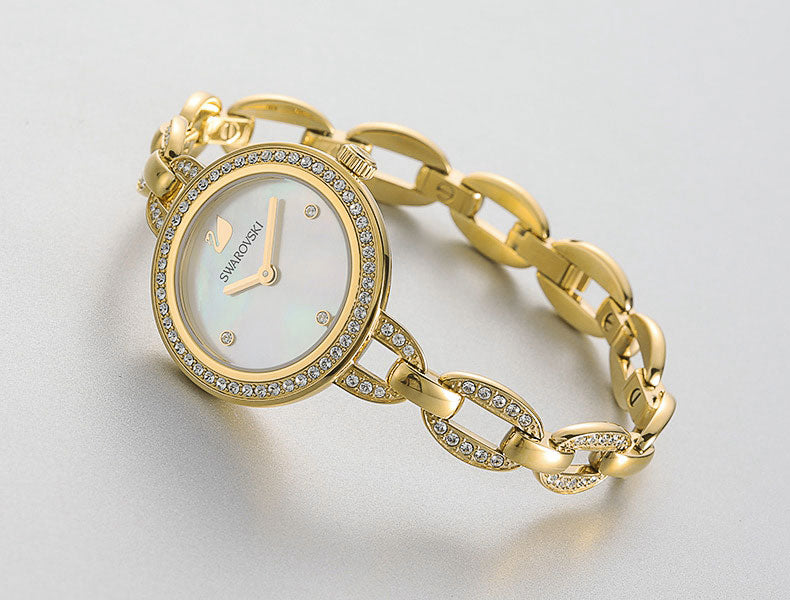 Angled view of Swarovski Aila Mini gold watch with white dial and crystal accents